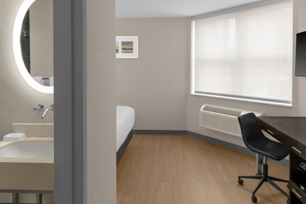 a room with a bed and a chair